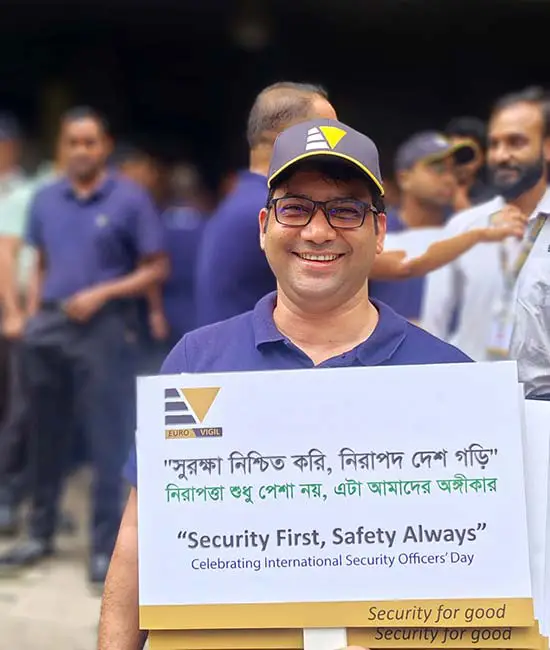 Euro Vigil team celebrating International Security Officers Day in Bangladesh holding a Security First Safety Always placard