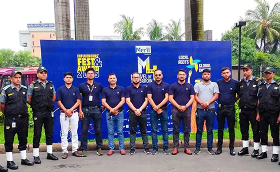 Event Security Services by Euro Vigil, security guards and management team standing in front of an event backdrop in Bangladesh.