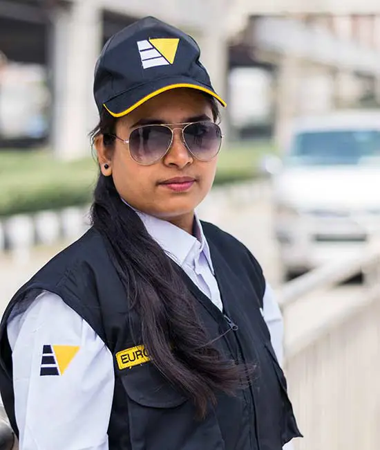 Professional security officer from Euro Vigil Female Security Guard Service in Bangladesh wearing a uniform cap and sunglasses